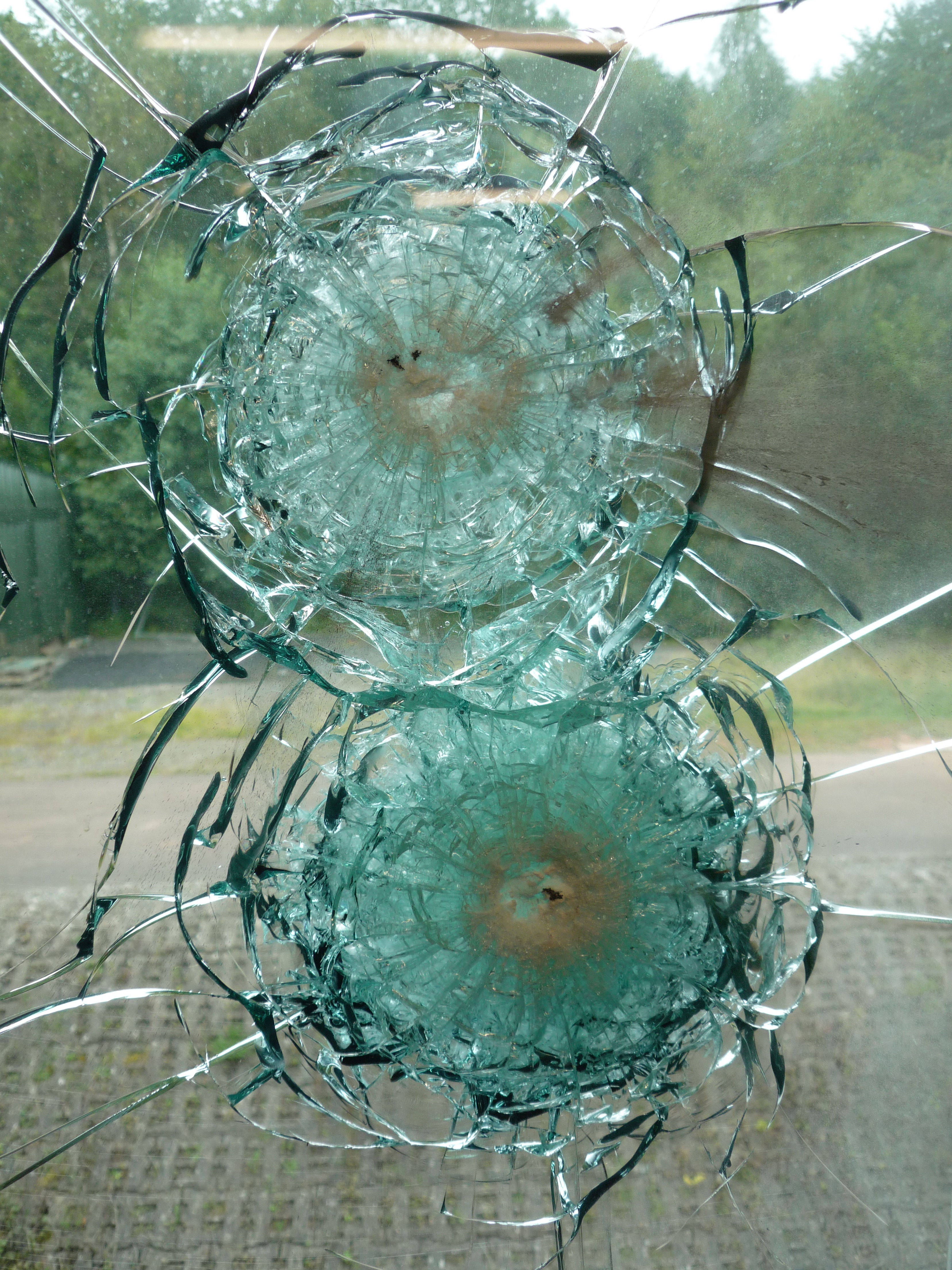 bullet resistant glass after impact from ammunition.